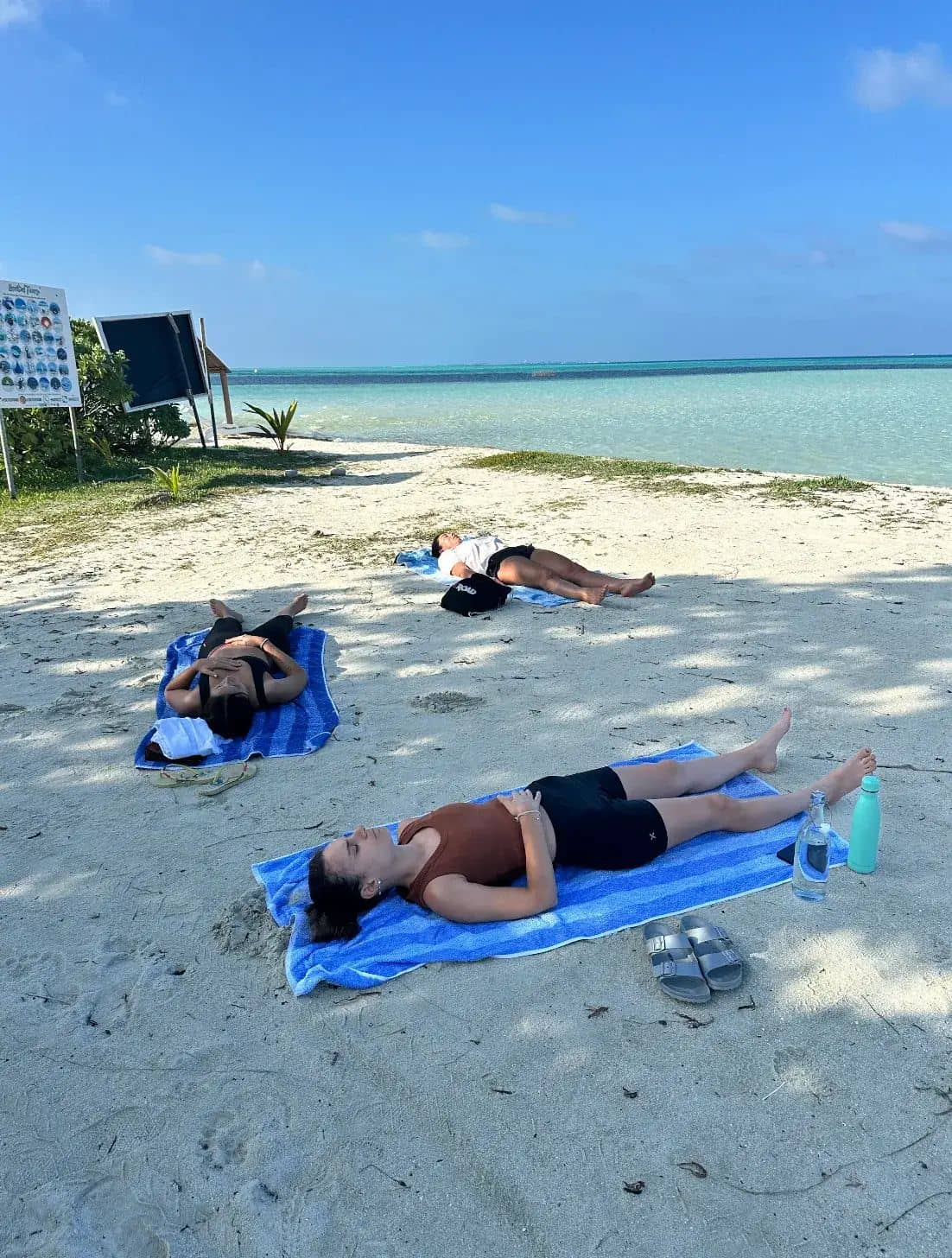 The group resting on a beach in Sardinia